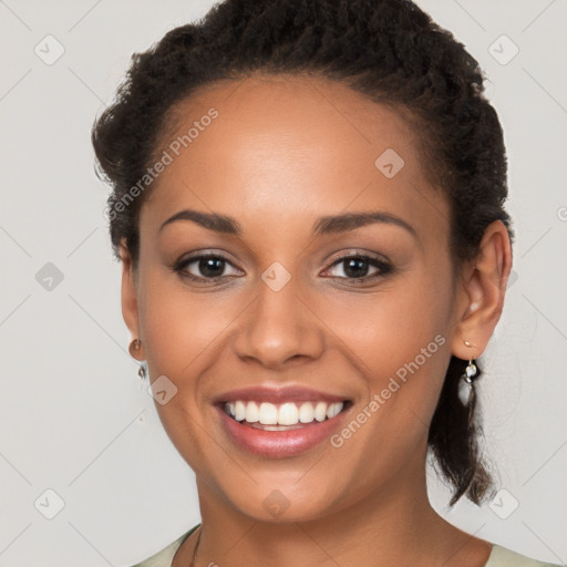 Joyful latino young-adult female with long  brown hair and brown eyes