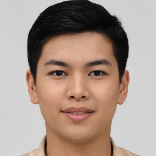 Joyful asian young-adult male with short  black hair and brown eyes