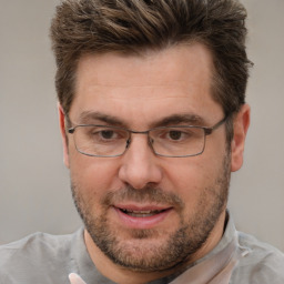 Joyful white adult male with short  brown hair and brown eyes