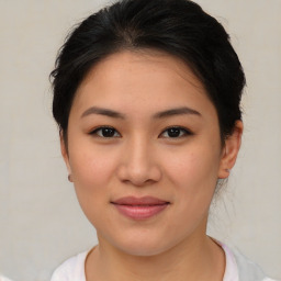 Joyful asian young-adult female with medium  brown hair and brown eyes