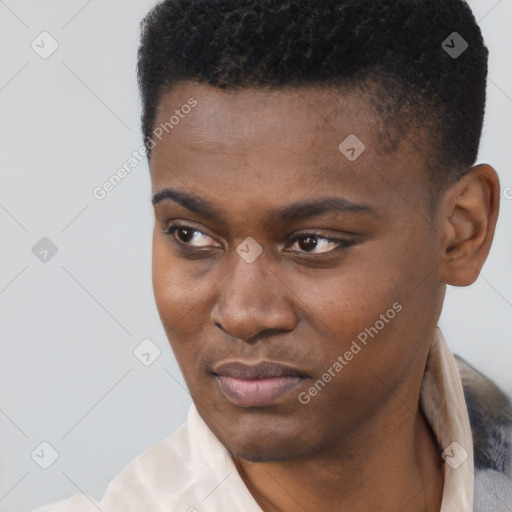 Joyful black young-adult male with short  black hair and brown eyes