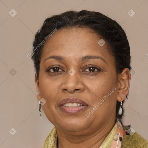 Joyful black adult female with short  brown hair and brown eyes