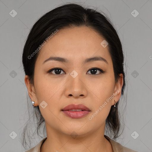 Joyful asian young-adult female with medium  brown hair and brown eyes