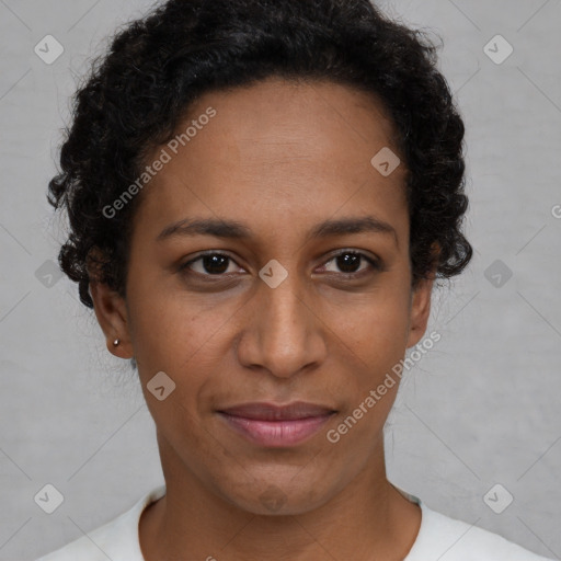 Joyful black young-adult female with short  brown hair and brown eyes