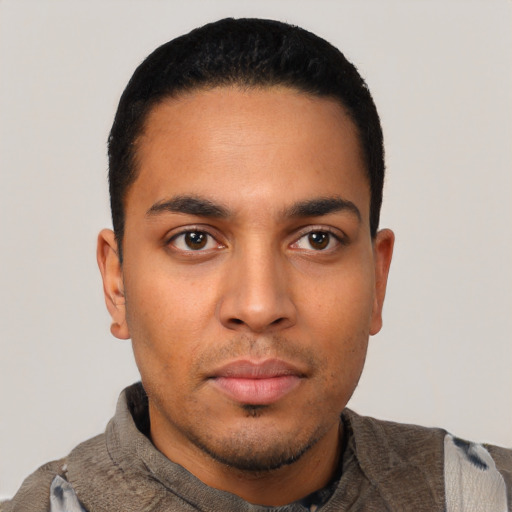 Neutral latino young-adult male with short  black hair and brown eyes