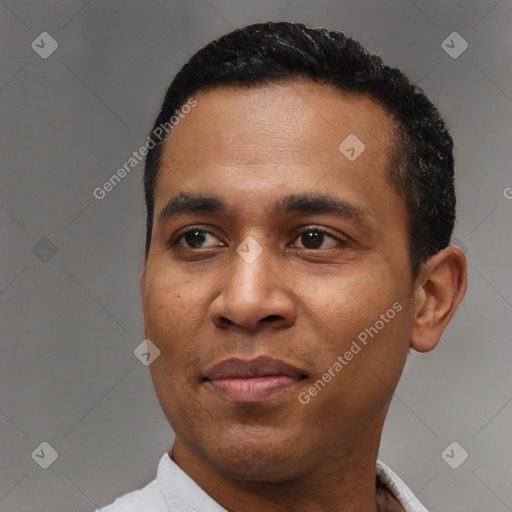 Joyful latino young-adult male with short  black hair and brown eyes