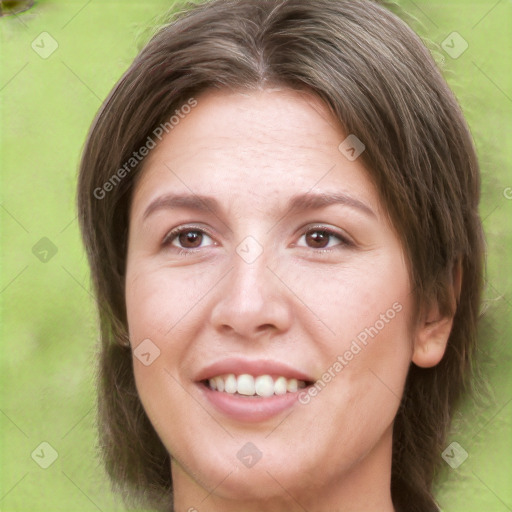 Joyful white young-adult female with long  brown hair and brown eyes