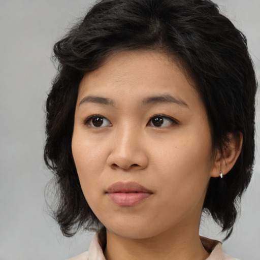 Neutral asian young-adult female with medium  brown hair and brown eyes