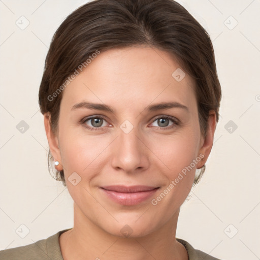 Joyful white young-adult female with short  brown hair and grey eyes