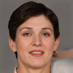 Joyful white adult female with short  brown hair and brown eyes