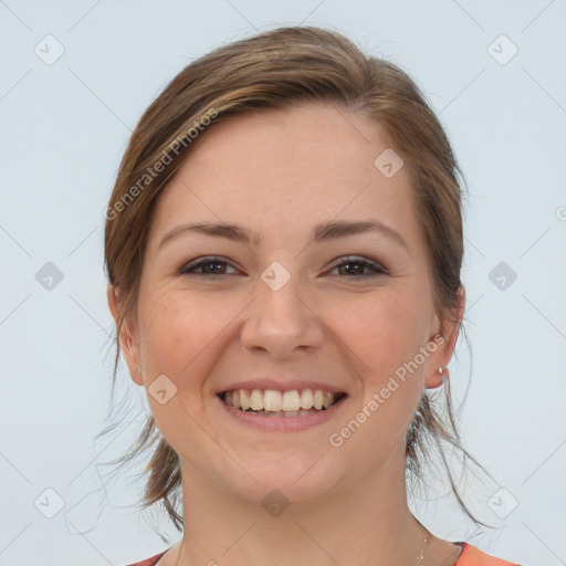 Joyful white young-adult female with medium  brown hair and grey eyes