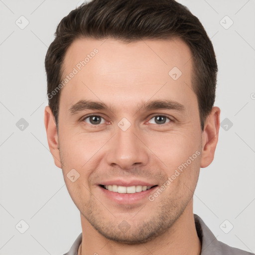 Joyful white young-adult male with short  brown hair and brown eyes