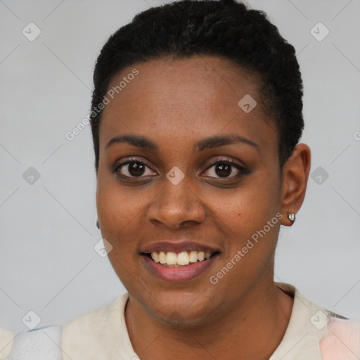 Joyful black young-adult female with short  black hair and brown eyes
