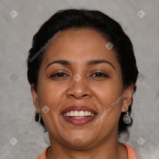 Joyful latino adult female with short  brown hair and brown eyes