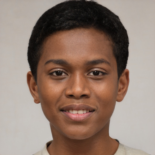 Joyful black young-adult male with short  brown hair and brown eyes