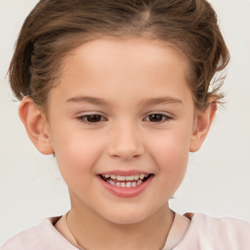 Joyful white child female with medium  brown hair and brown eyes