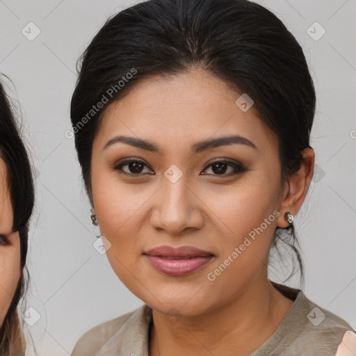 Joyful latino young-adult female with medium  brown hair and brown eyes