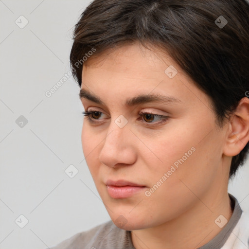 Neutral white young-adult female with short  brown hair and brown eyes