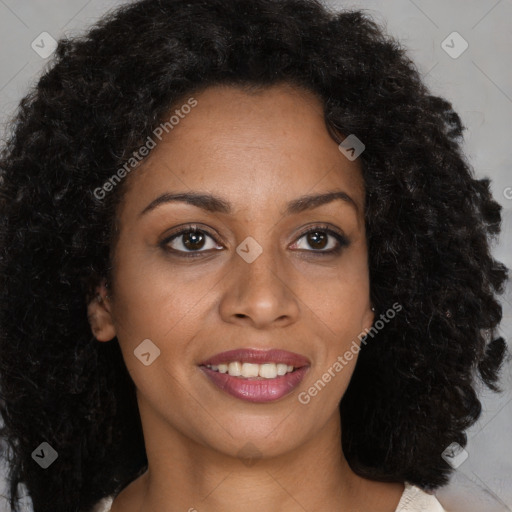 Joyful black young-adult female with long  brown hair and brown eyes