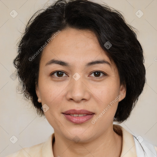 Joyful latino adult female with medium  brown hair and brown eyes