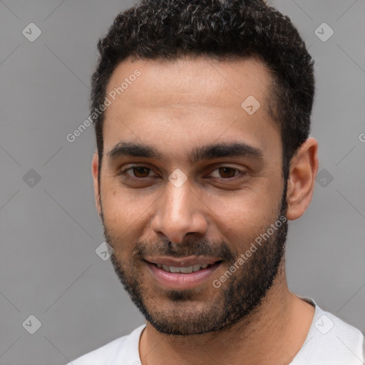 Joyful white young-adult male with short  black hair and brown eyes