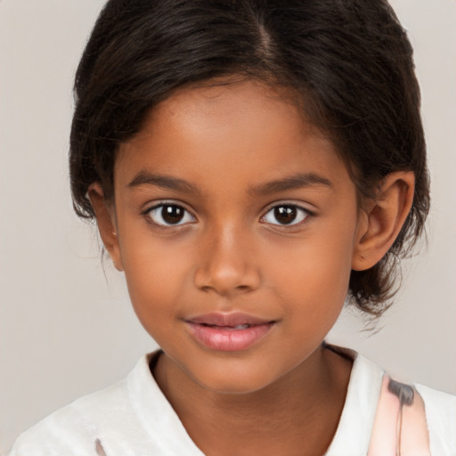 Joyful latino child female with medium  brown hair and brown eyes