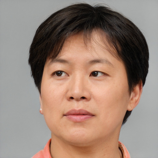 Neutral asian adult female with short  brown hair and brown eyes