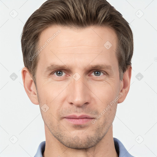 Joyful white adult male with short  brown hair and grey eyes