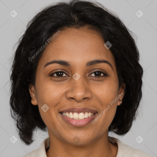 Joyful black young-adult female with medium  brown hair and brown eyes