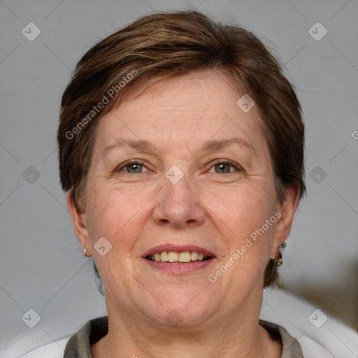 Joyful white adult female with short  brown hair and grey eyes