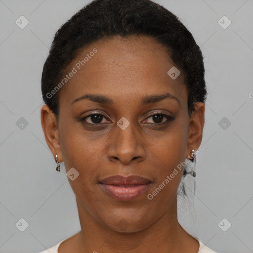 Joyful black young-adult female with short  brown hair and brown eyes
