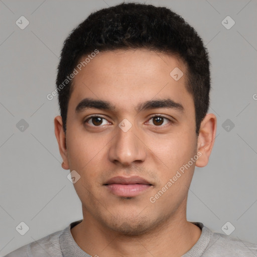 Neutral latino young-adult male with short  black hair and brown eyes