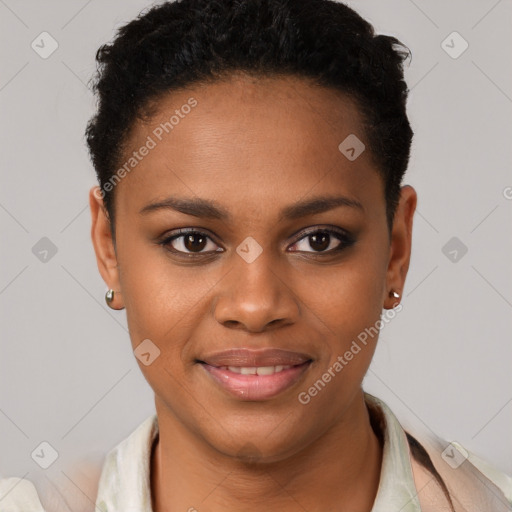 Joyful black young-adult female with short  black hair and brown eyes