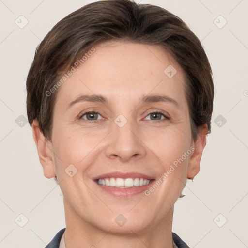 Joyful white adult female with short  brown hair and grey eyes