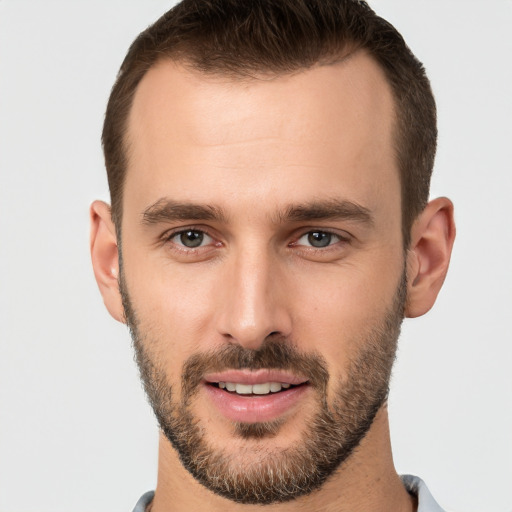 Joyful white young-adult male with short  brown hair and brown eyes