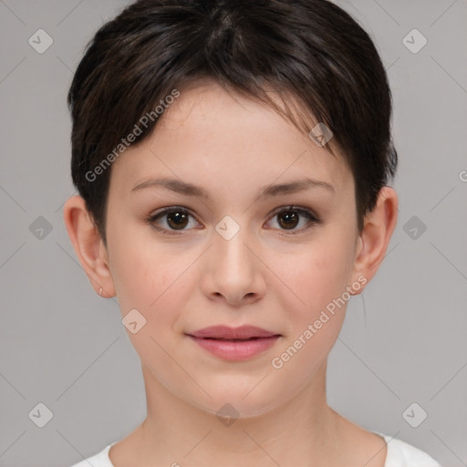 Joyful white child female with short  brown hair and brown eyes