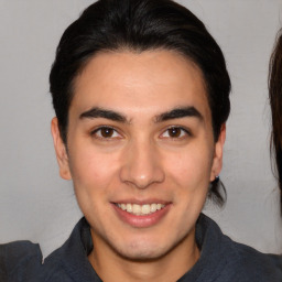 Joyful white young-adult male with medium  brown hair and brown eyes