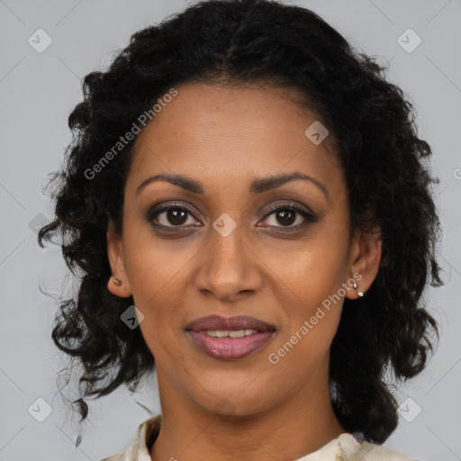 Joyful black adult female with medium  brown hair and brown eyes