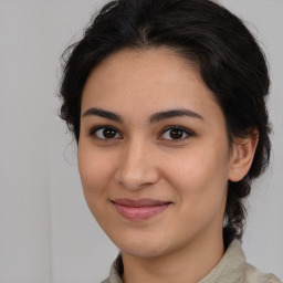 Joyful latino young-adult female with medium  brown hair and brown eyes