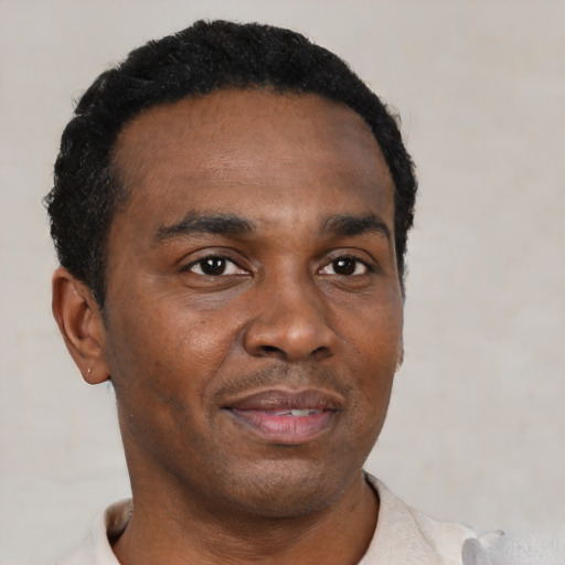 Neutral black young-adult male with short  black hair and brown eyes