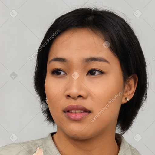 Neutral asian young-adult female with medium  black hair and brown eyes