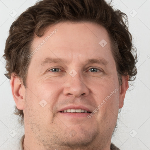 Joyful white adult male with short  brown hair and grey eyes