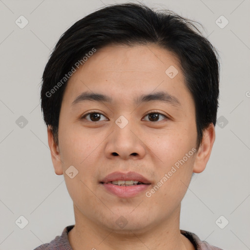 Joyful asian young-adult male with short  brown hair and brown eyes