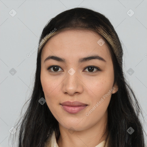 Joyful latino young-adult female with long  brown hair and brown eyes