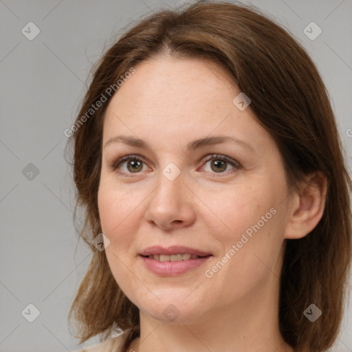 Joyful white adult female with medium  brown hair and brown eyes