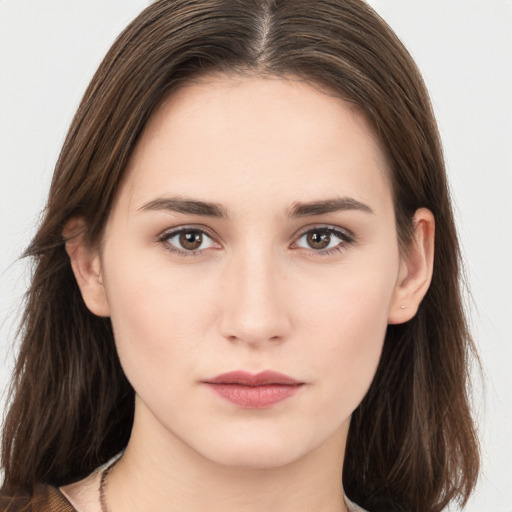 Neutral white young-adult female with long  brown hair and brown eyes