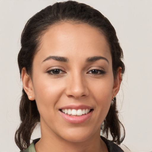 Joyful white young-adult female with medium  brown hair and brown eyes