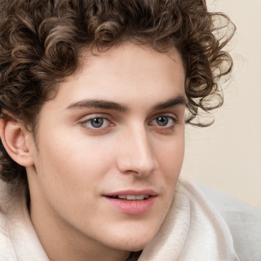 Joyful white young-adult male with medium  brown hair and brown eyes