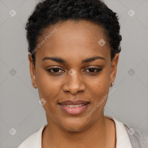 Joyful black young-adult female with short  black hair and brown eyes