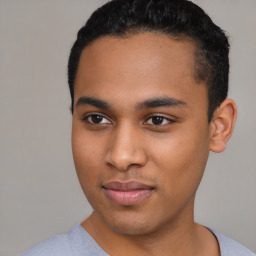 Joyful latino young-adult male with short  black hair and brown eyes